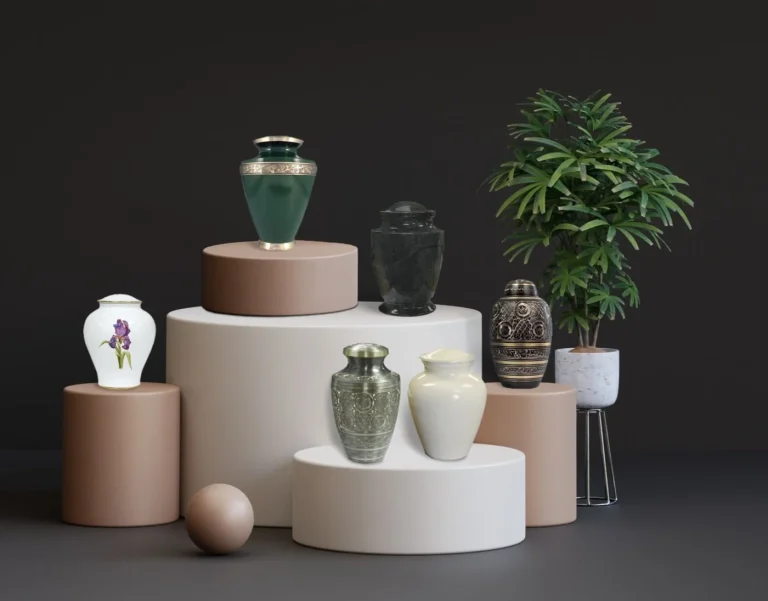 A collection of six decorative urns in various colors and designs is displayed on beige and white cylindrical pedestals, with a green potted plant on the right, all set against a dark background.